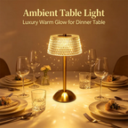 Dome lamp lit on a dinner table set with glasses and plates