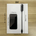 The projector on a sheet of A4 paper for scale, 28 cm long with a 2.5 cm head