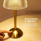 A finger on the knob at the base, next to the USB charging port