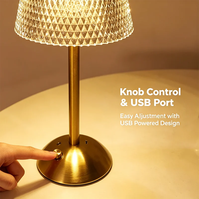 A finger on the knob at the base, next to the USB charging port