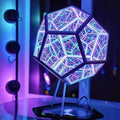 Twelve-sided infinity mirror lamp lit purple and blue on its metal stand