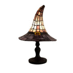 Witch hat lamp lit, on a white background