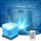 Clear ripple cube lit blue, throwing water ripples over a child's bedroom, with its remote