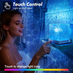 Woman in the shower reaching for the cube on a shelf, blue waves on the tiles